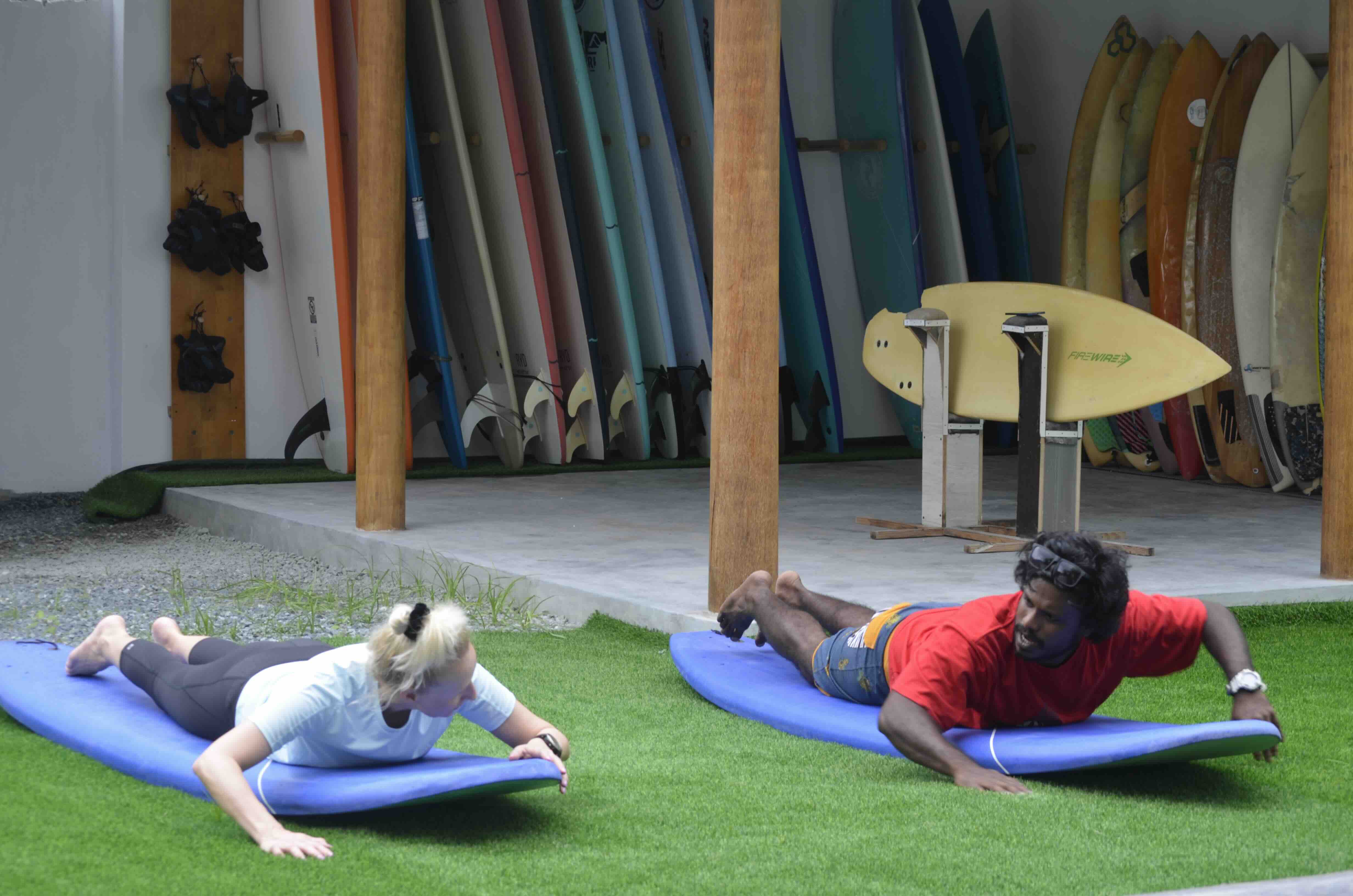 Sambe teaching a student on land